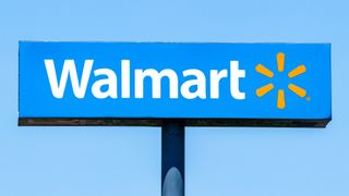 Walmart sign shown against blue sky