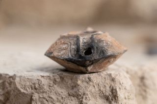 Fully intact clay lamp from the Islamic Golden Age, found at the same site as the amulet