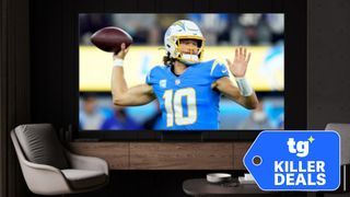 A wall-mounted, big-screen TV displaying an NFL player mid-pass. A super-imposed badge reads: "TG Killer Deals".