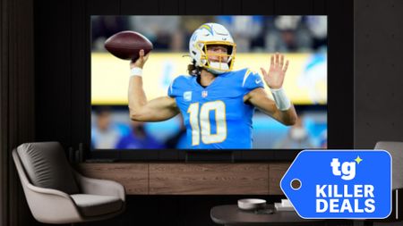 A wall-mounted, big-screen TV displaying an NFL player mid-pass. A super-imposed badge reads: "TG Killer Deals".
