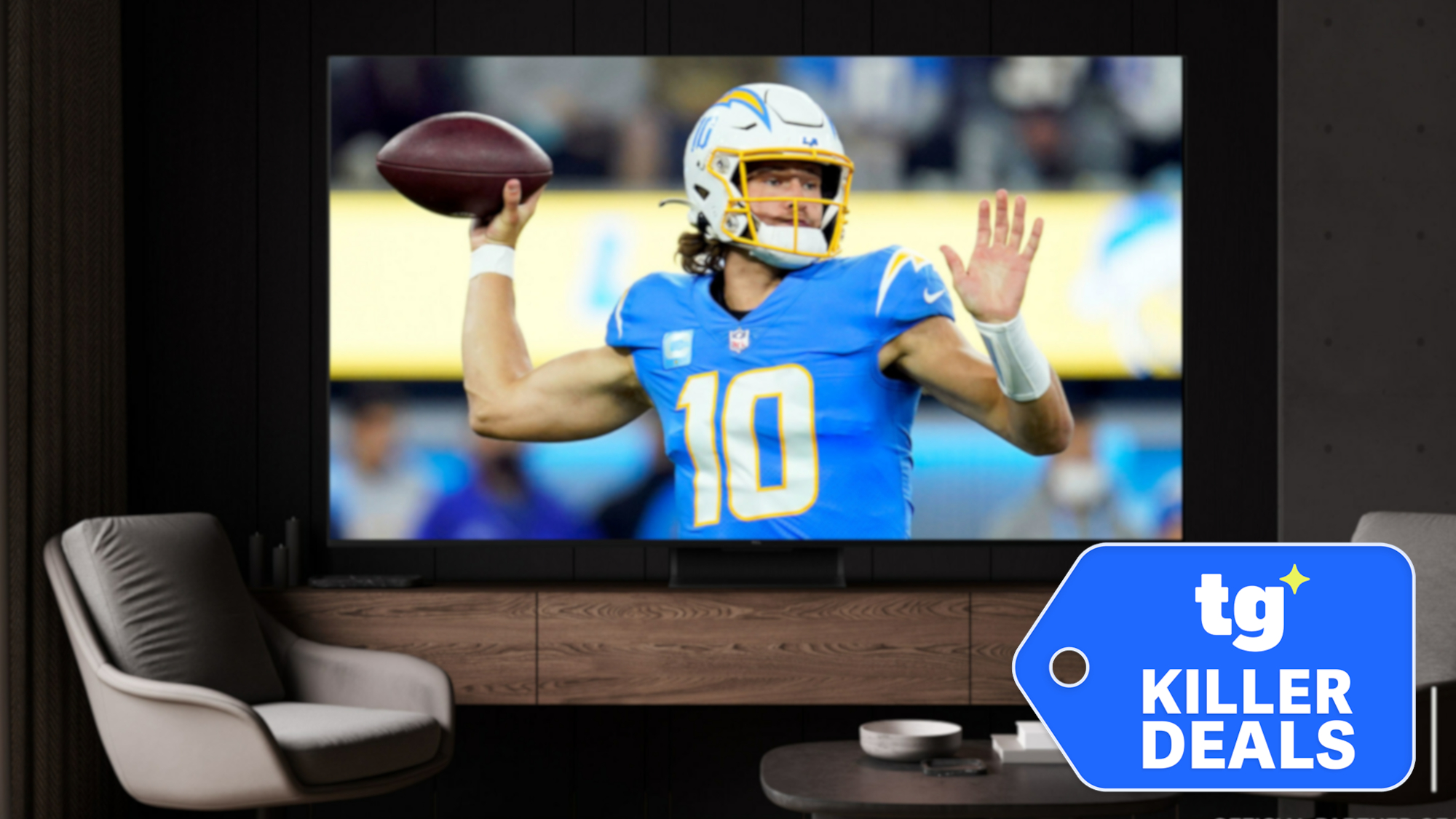 A wall-mounted, big-screen TV displaying an NFL player mid-pass. A super-imposed badge reads: "TG Killer Deals".