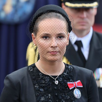 Crown Princess Ingrid Alexandra wearing black and a veil at King Harald's funeral