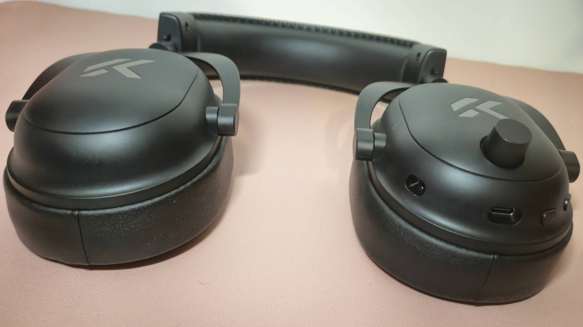 Close up of the black earcups of the Mchose V9 Turbo wireless gaming headset.