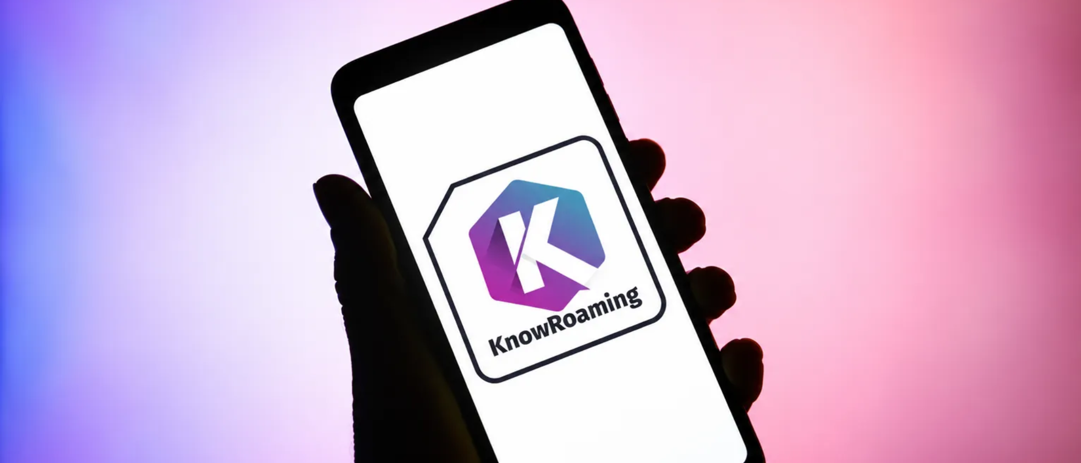 KnowRoaming logo on a silhouetted phone and hand