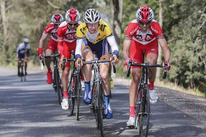 Nathan Earle drifts backwards after delivering Jack Haig (Huon-Genesys) back to the lead group after a puncture