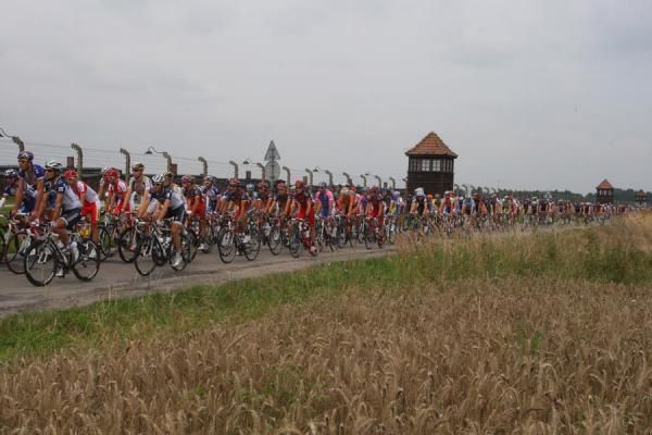 The peloton passes the site of the former Auschwitz camp