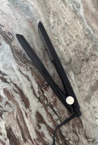 GHD Max hair straightener on marble surface