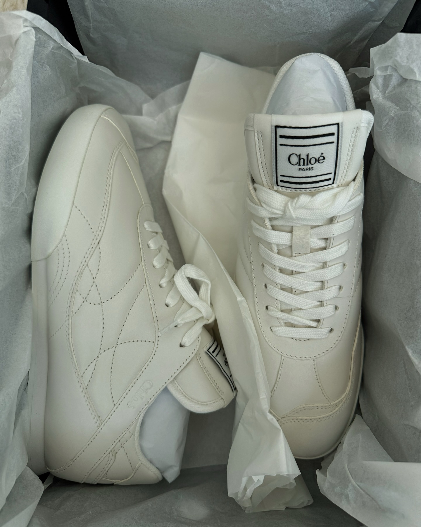 @anoukyve showcases off-white trainers with sporty stitching whilst in their box