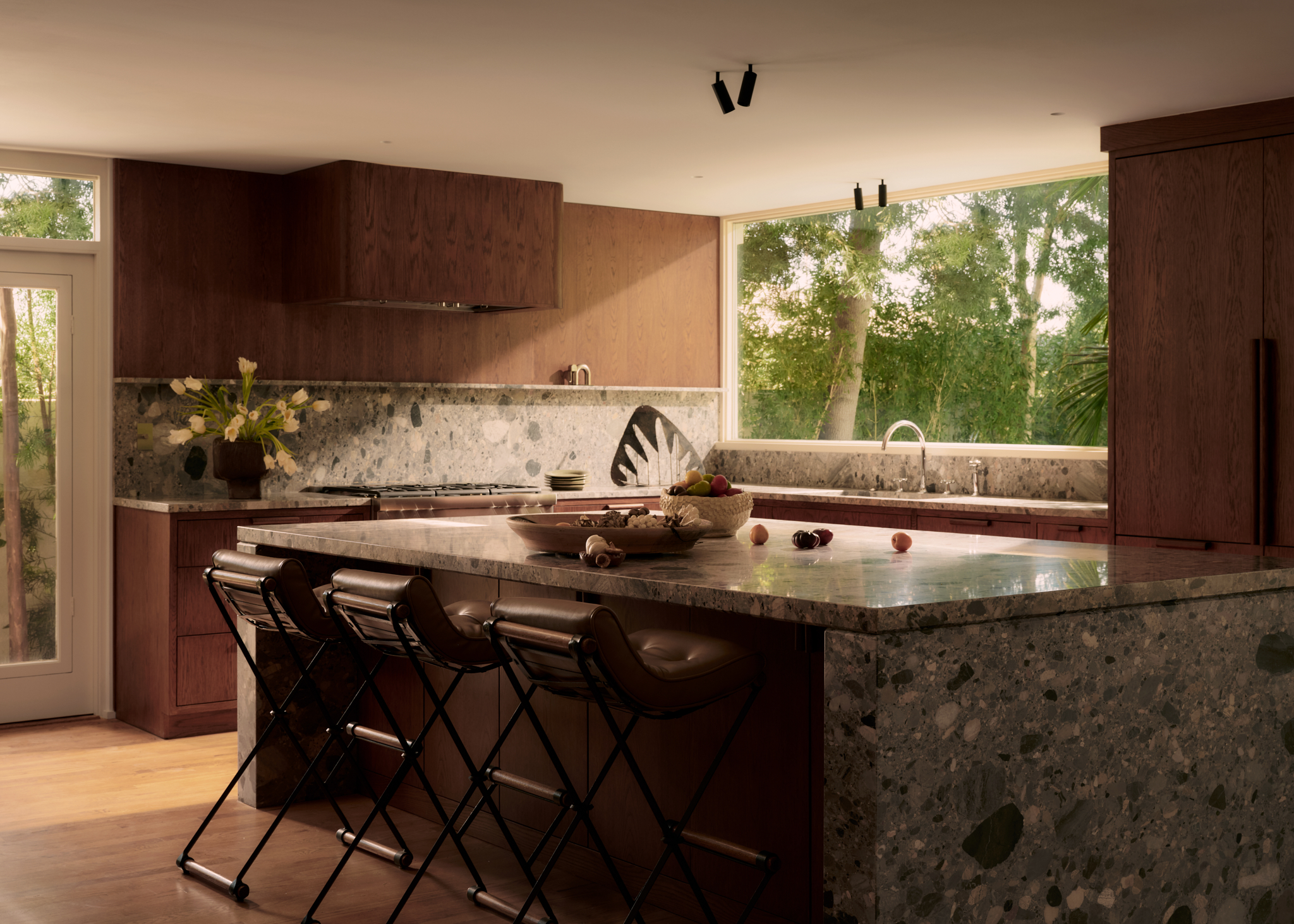 Kitchen with central island that has a large picture window