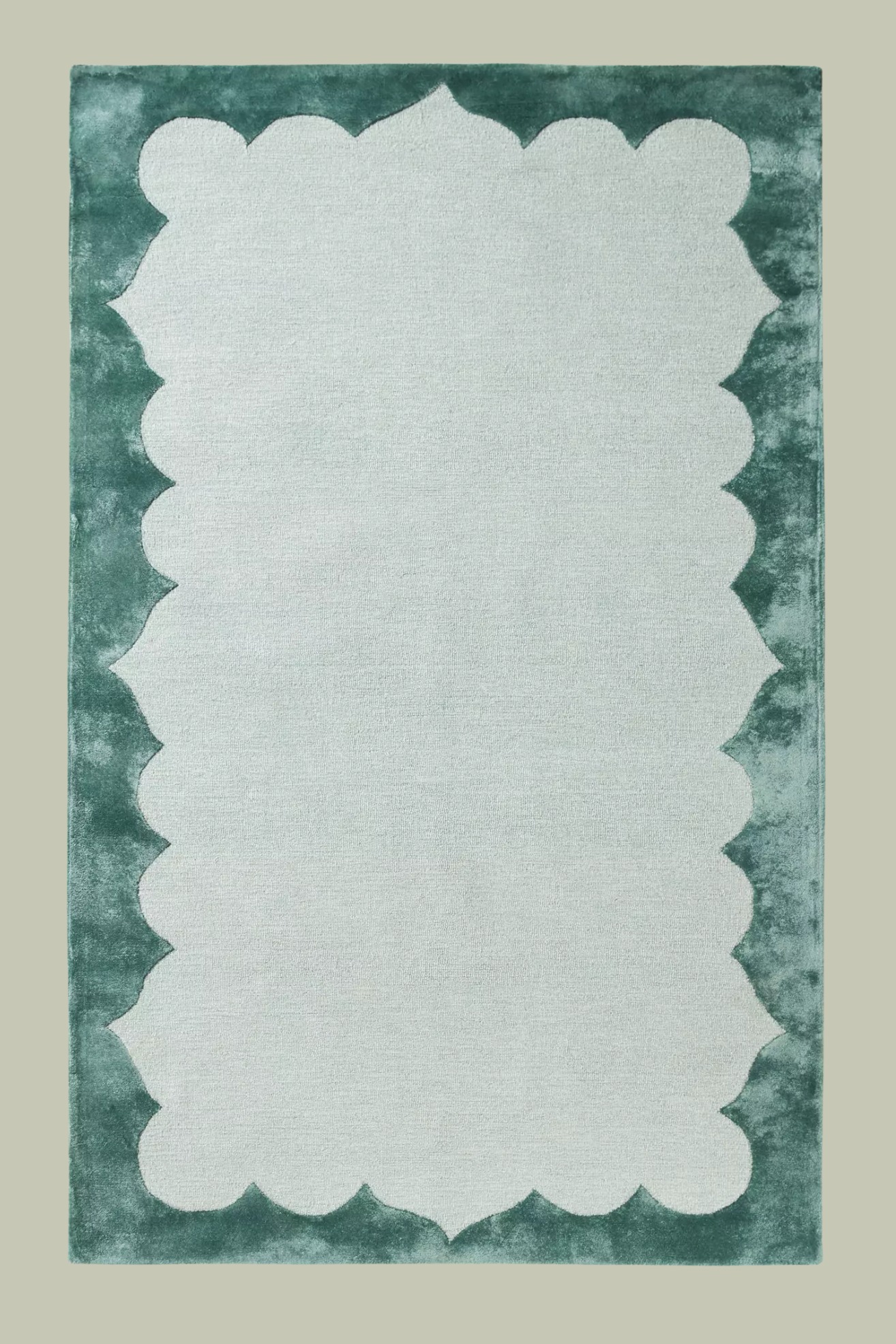 A teal green rug with a soft border