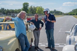 James May, Richard Hammond and Jeremy Clarkson next to a car