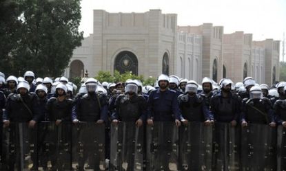 Policemen guard the prime minister's office in Manama, Bahrain as protests continue.