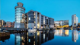Blue hour image of Leeds docks shot with long exposure to give a stronger reflection in the water