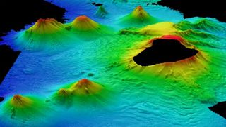 Volcanoes! The team mapped an area about 100 miles wide and nearly the length of Britain. The missing parts of the image are where islands blocked the research vessel's mapping sonar.
