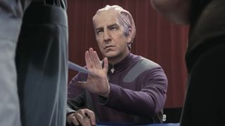 Alan Rickman, as Alexander Dane, reluctantly signs autographs in Galaxy Quest