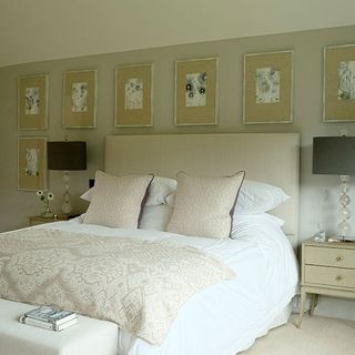 bedroom with bed and cushions bedside glass lamp bases