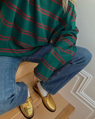 Influencer wears gold boots