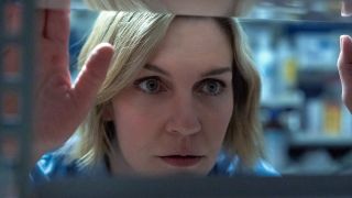 Carol looking through shelves in Pluribus Episode 4