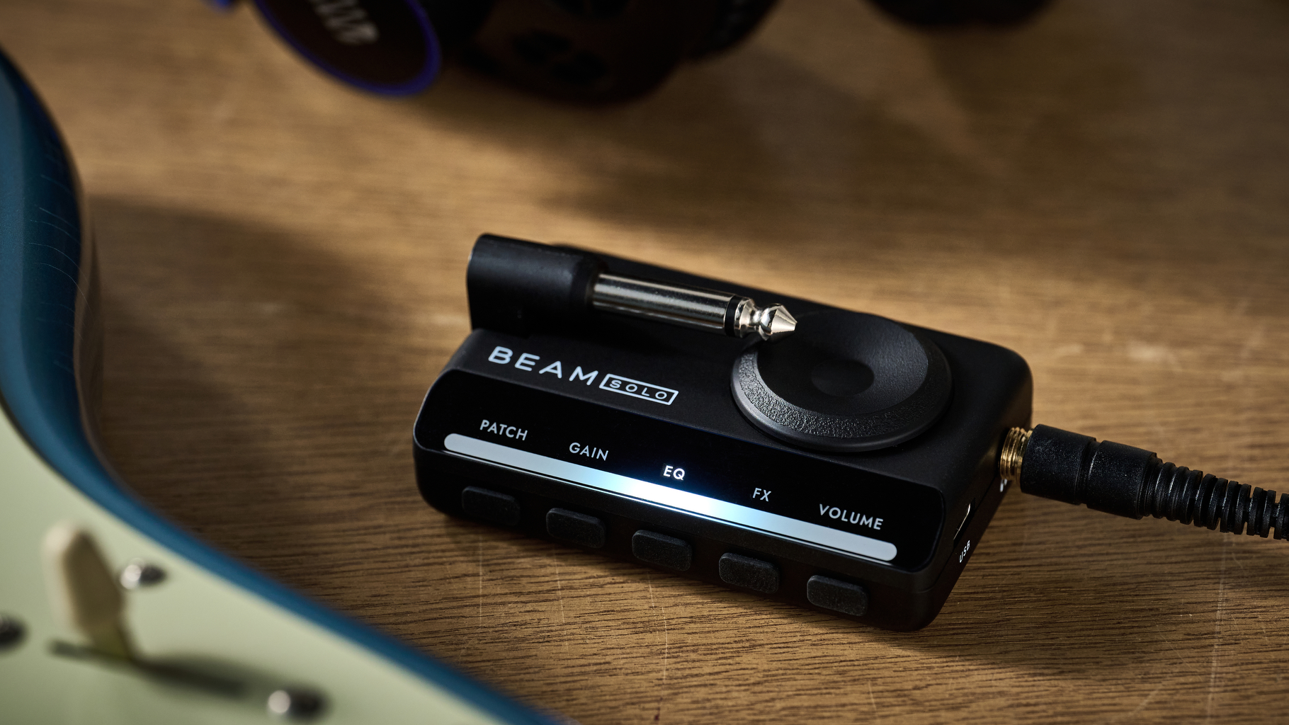 A Blackstar Beam Solo guitar headphone amp ona wooden table