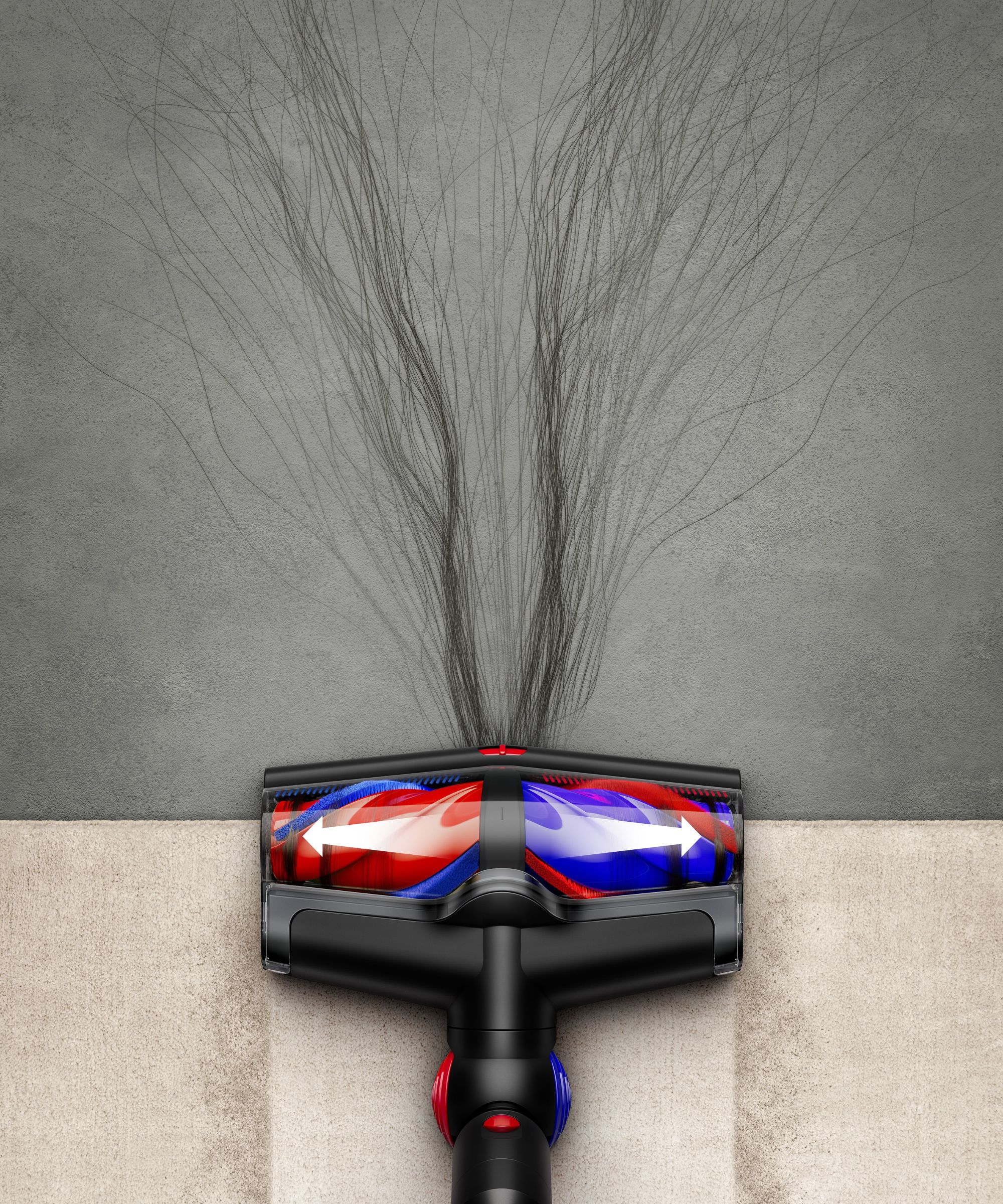 Dyson V16 Piston Animal on wooden floor and gray floor with long hair strands pictured coming out of floorhead.