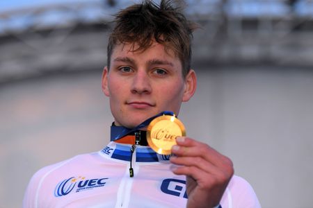 Mathieu van der Poel shows off his medal