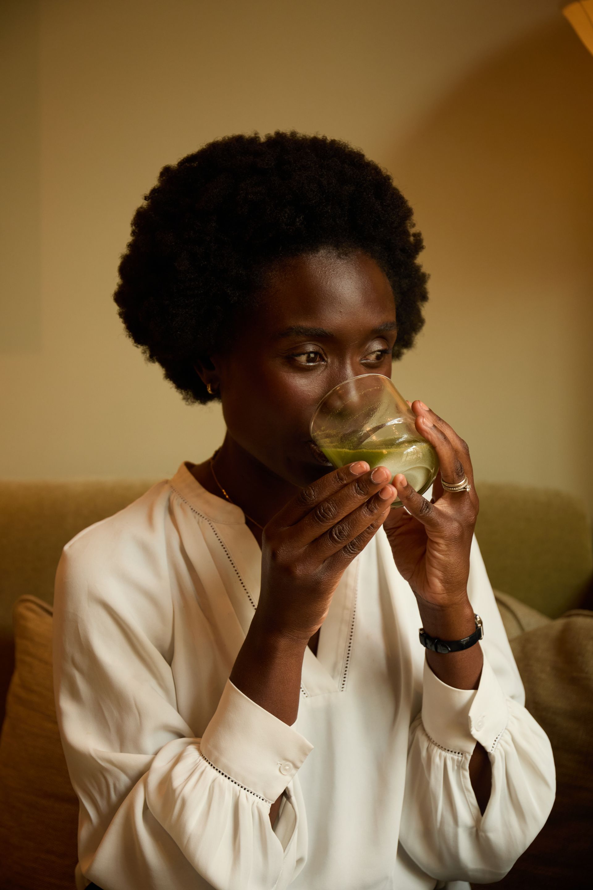 Dr Mary Sommerlad drinking the We Are Regular supplement from a glass