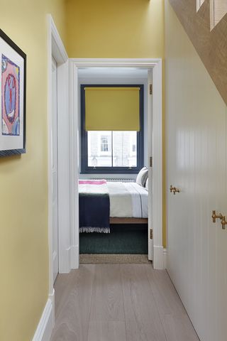 bedroom with dark blue window frame