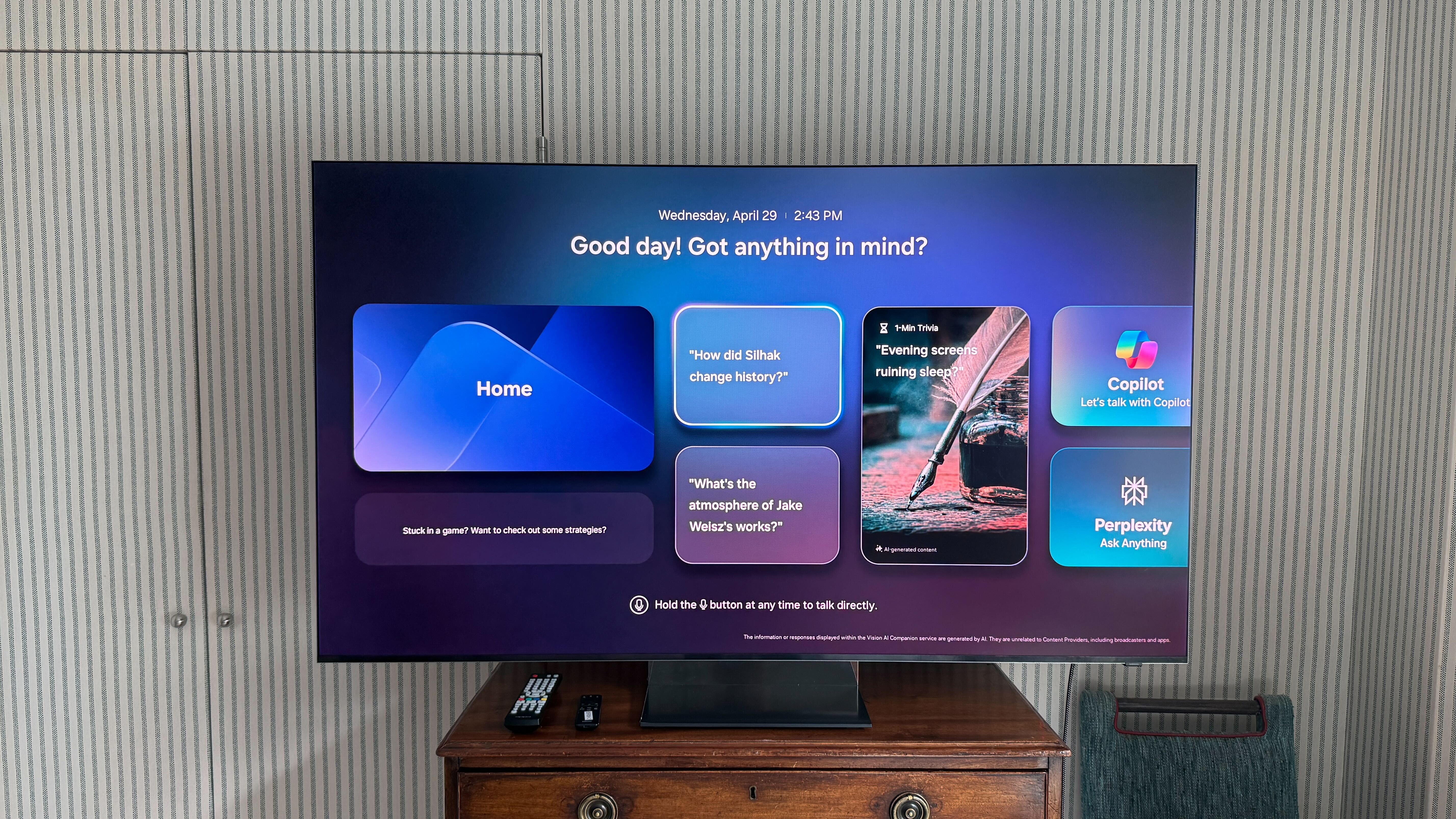 Samsung R95H on top of a wooden chest of drawers