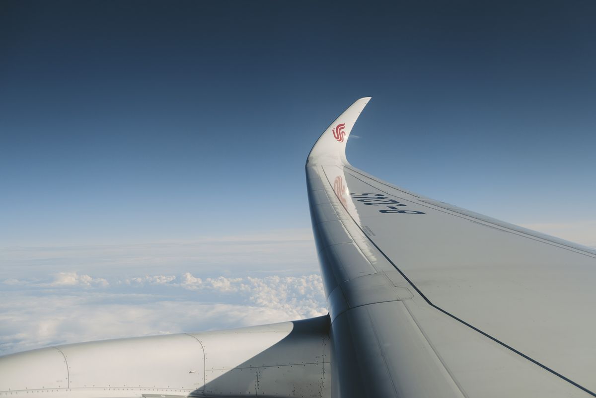 Sample image taken with the Panasonic Lumix L10; wing of a plane above the clouds