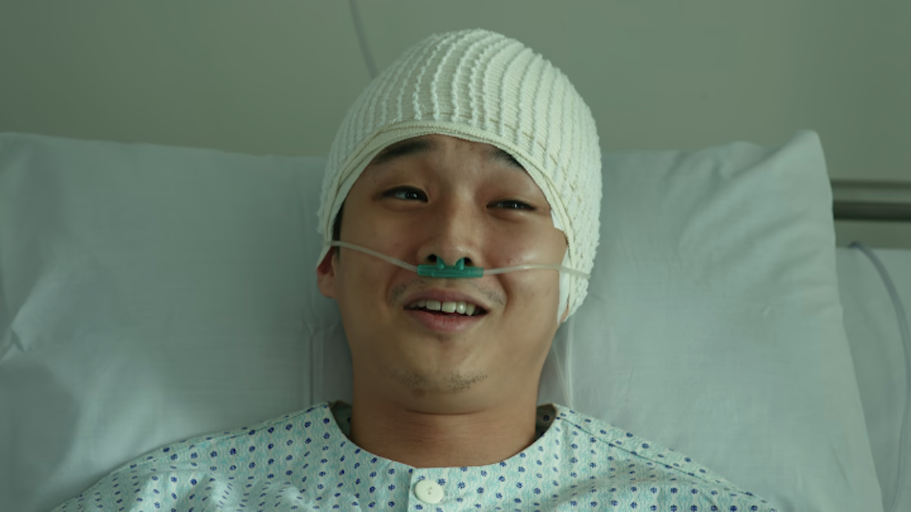 Choi Woo-shik at the hospital laughing in Parasite