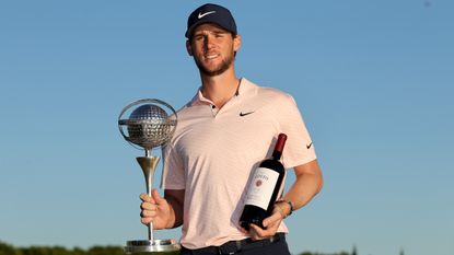 Thomas Pieters poses with the trophy after winning the 2021 Portugal Masters