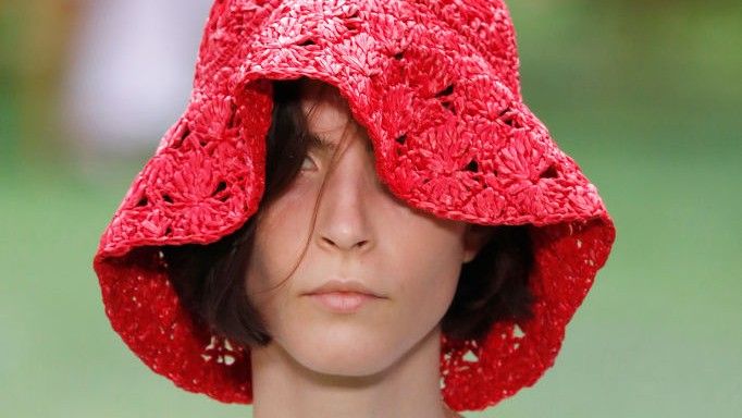 a model wearing a crochet hat