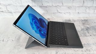 A photograph of the Dell Latitude 7320 from the side