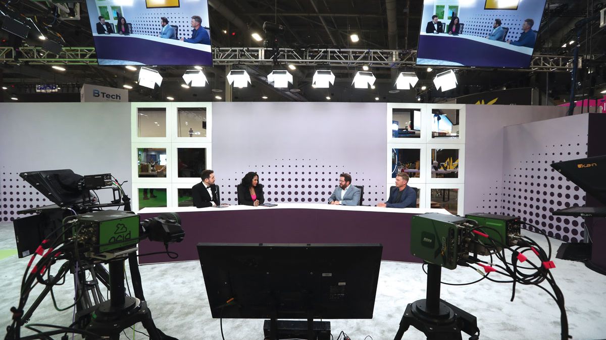 Four hosts discuss the day&#039;s events at InfoComm 2024 on the AVIXA TV set.