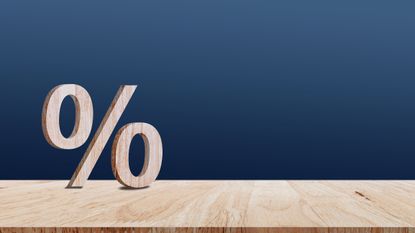 Close-up of zero percent sign on wooden table, 