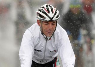 A waterlogged Riccardo Ricco finishes the stage in Calcinato