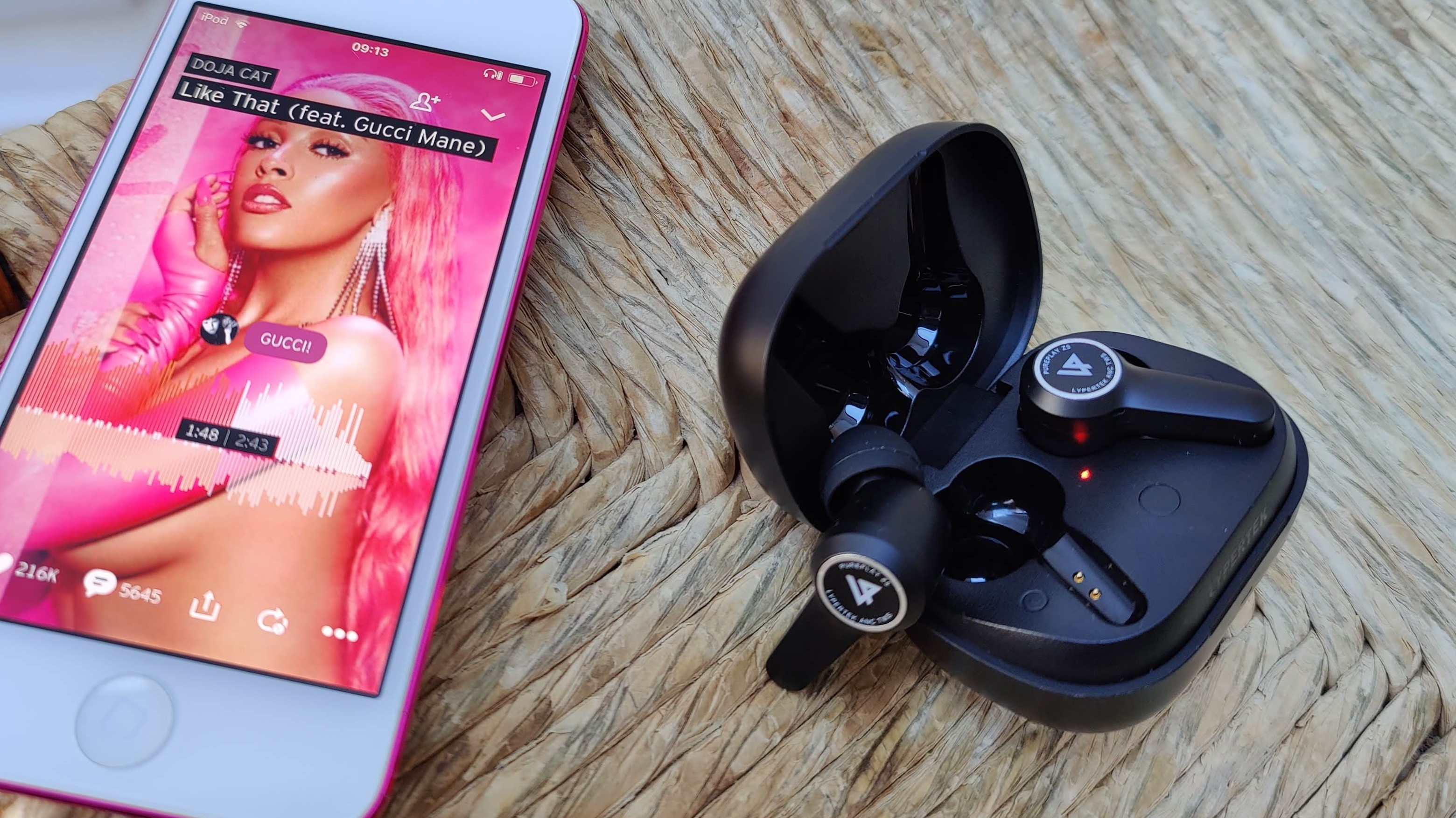 Lypertek PurePlay Z5 earplugs in charging case with iPhone