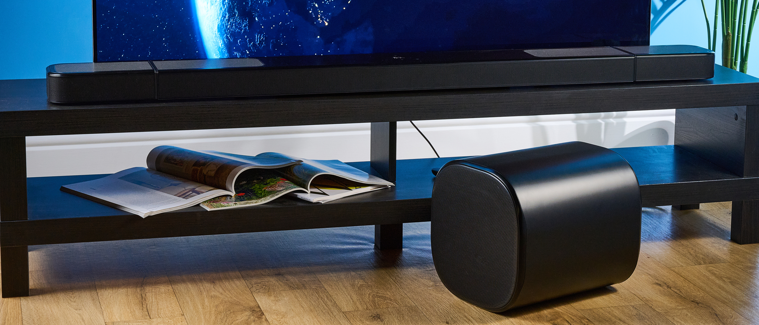 the jbl bar 1300xmk2 in black photographed against the blue tom's guide background