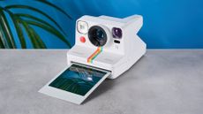 A white Polaroid Now+ Gen 2 instant camera