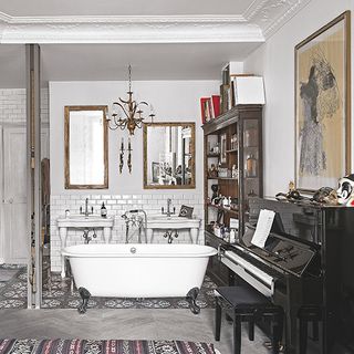 bathroom with with vintage bathtub and bookshelf