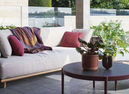 A backyard with sofa furnished with texture and color