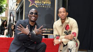 US singer and actor Tyrese Gibson (L) and US rapper Chris "Ludacris" Bridges pose for a photo during the Walk of Fame star ceremony of Ludacris, in Hollywood, California, on May 18, 2023