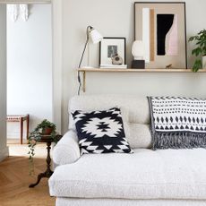 Living room with small black side table and floor lamp