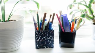 Pens and pencils on the windowsill