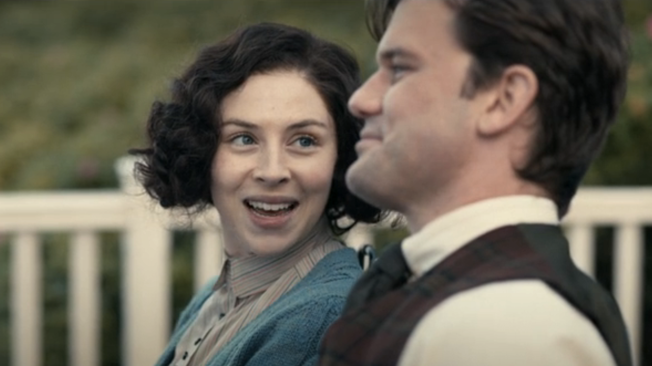 julia and henry talking in the 1900s on outlander: blood of my blood