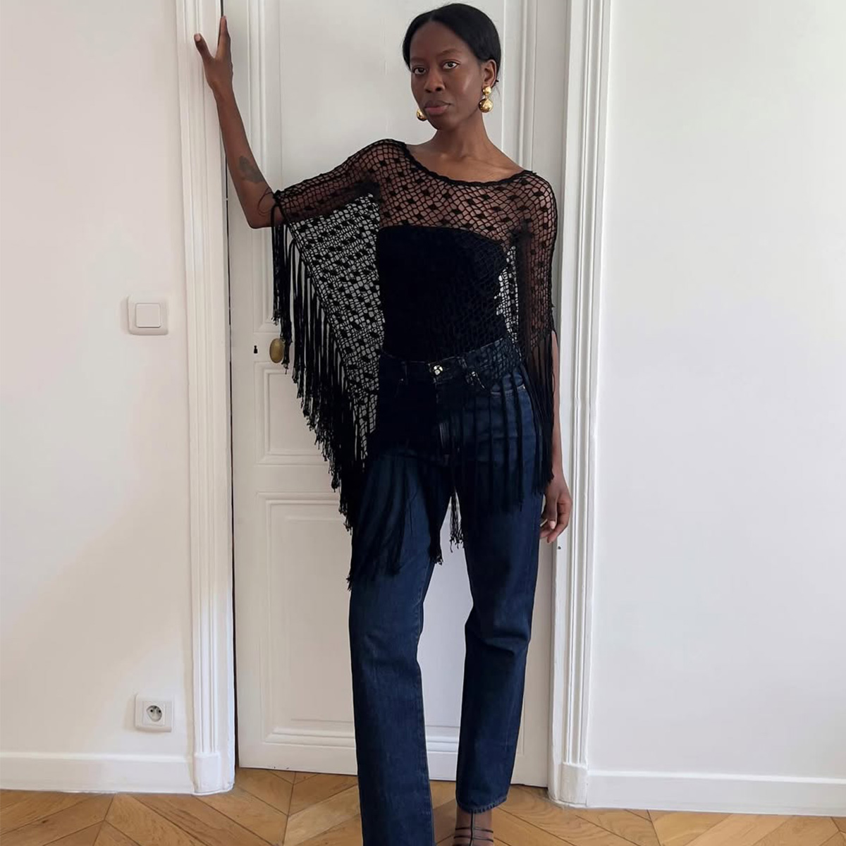 Sylvie Mus wearing a poncho.