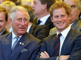 Prince Harry and King Charles laugh together at the opening ceremony of the Invictus Games in 2014