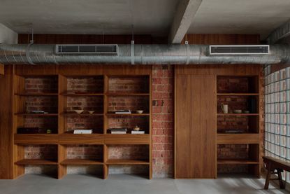 'My last home' a Singapore terrace by L Architects, a raw interior space of exposed brown brick and wood detailing