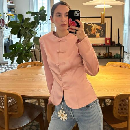 Woman in pale pink jacket