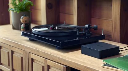 Best streaming DACs image shows Sonos Port attached to turntable on wooden side table